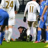 A ballboy (C) lies on the ground and reacts after a altercation with Chelsea's Belgium midfielder Eden Hazard  (Photo credit should read ANDREW YATES/AFP via Getty Images)