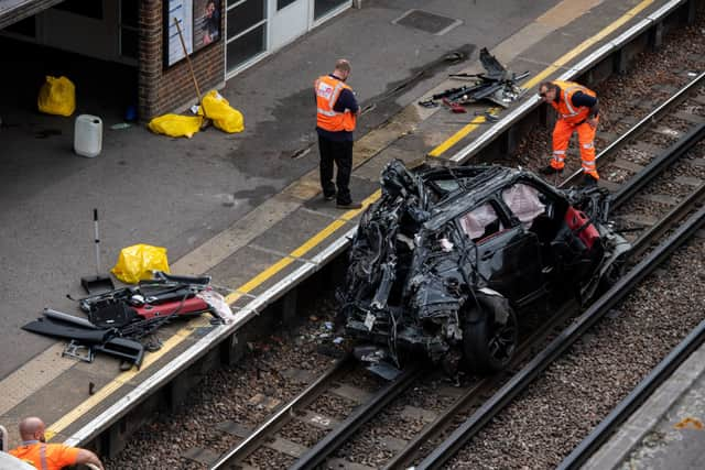 Wreckage of Range Rover on Tube tracks at Park Royal Underground.