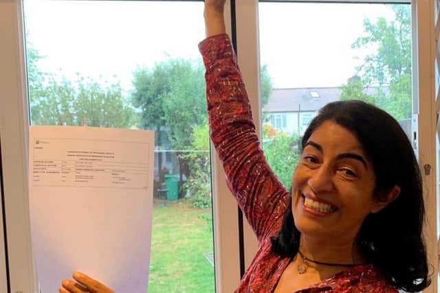 Sasha Chaudri with her GCSE results. Credit: SWNS