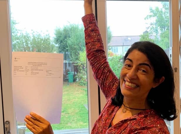 <p>Sasha Chaudri with her GCSE results. Credit: SWNS</p>