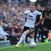 Jay Stansfield of Fulham is challenged by Rico Henry of Brentford during the Premier League match between Fulham FC and Brentford FC