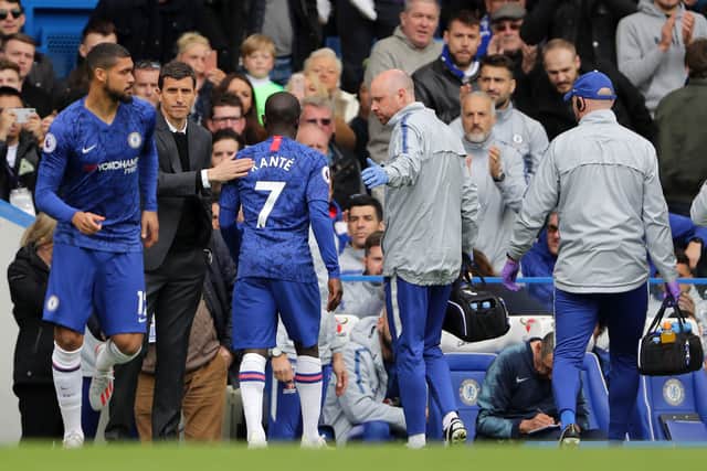 An injured N’golo Kante of Chelsea leaves the pitch during the Premier League match (Photo by Richard Heathcote/Getty Images)