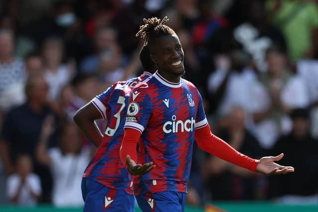 Wilfried Zaha of Crystal Palace smiles after scoring their second goal during the Premier League match  (Photo by Christopher Lee/Getty Images)