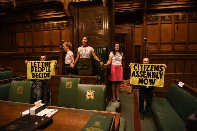 Extinction Rebellion protestors have glued themselves to the Speaker’s Chair in the House of Commons. Credit: Extinction Rebellion