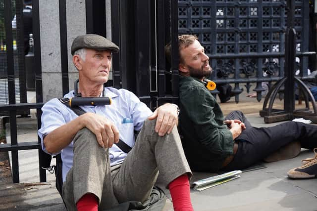 Two protesters could also be seen with locks around their necks