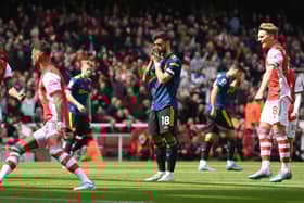 Bruno Fernandes of Manchester United reacts after missing a penalty during the Premier League match between Arsenal and Manchester United