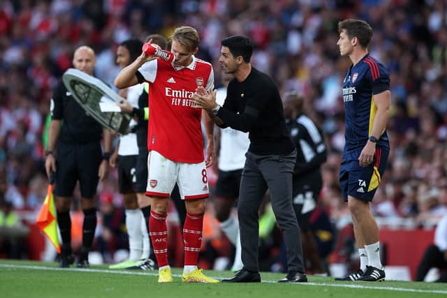 Martin Odegaard of Arsenal interacts with Mikel Arteta, Manager of Arsenal during the Premier League  (Photo by Eddie Keogh/Getty Images)