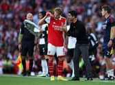 Martin Odegaard of Arsenal interacts with Mikel Arteta, Manager of Arsenal during the Premier League  (Photo by Eddie Keogh/Getty Images)