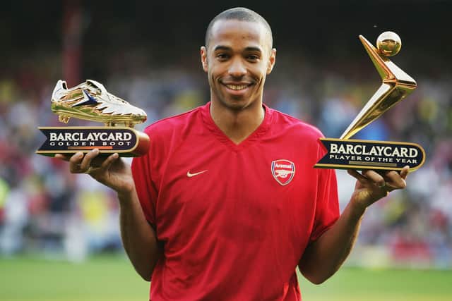 Thierry Henry of Arsenal shows off his Golden Boot and Barclaycard Premiership Player of the Year Award (Photo by Clive Mason/Getty Images)