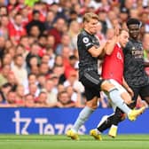 Christian Eriksen of Manchester United is fouled by Martin Oedegaard of Arsenal during the Premier League match  (Photo by Michael Regan/Getty Images)