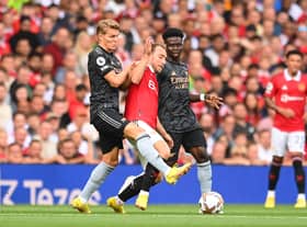 Christian Eriksen of Manchester United is fouled by Martin Oedegaard of Arsenal during the Premier League match  (Photo by Michael Regan/Getty Images)