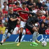 Cristiano Ronaldo of Manchester United in action with Arsenal’s Oleksandr Zinchenko and Gabriel (Photo by Tom Purslow/Manchester United via Getty Images)
