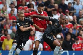 Cristiano Ronaldo of Manchester United in action with Arsenal’s Oleksandr Zinchenko and Gabriel (Photo by Tom Purslow/Manchester United via Getty Images)