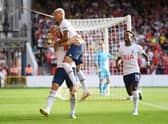 Harry Kane of Tottenham Hotspur celebrates with Richarlison after scoring their team's second goal  (Photo by Michael Regan/Getty Images)