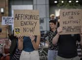 Protesters hold placards during a demonstration against rising energy prices outside Ofgem HQ. Photo: Getty