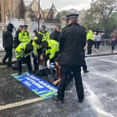 Protestors have sprayed the Parliament walls near Big Ben with “fake milk”. Photo: Animal Rebellion