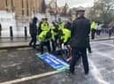 Protestors have sprayed the Parliament walls near Big Ben with “fake milk”. Photo: Animal Rebellion