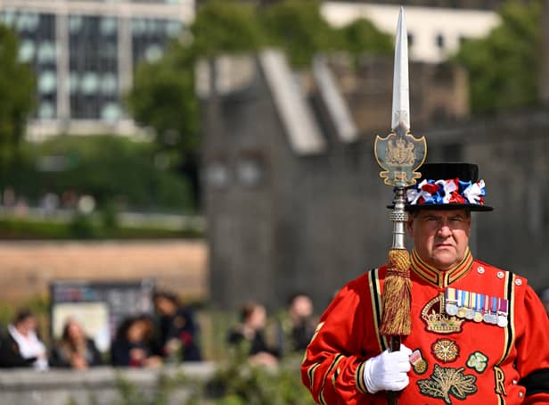 <p>A Yeomen Warders stands guard for the Death Gun Salute fired at the Tower of London, taking place to mark the death of Queen Elizabeth II.</p>