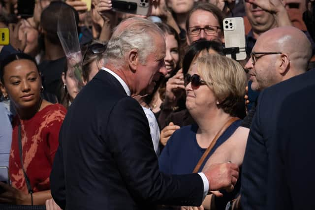 King Charles III greets well-wishers as he arrives at Buckingham Palace from Balmoral. Photo: Getty