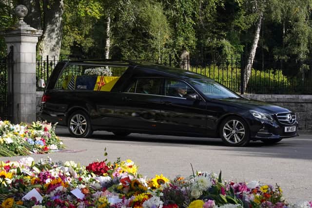 The hearse carrying the coffin of Queen Elizabeth II, draped with the Royal Standard of Scotland, leaving Balmoral as it begins its journey to Edinburgh. Picture date: Sunday September 11, 2022. (Photo: PA)