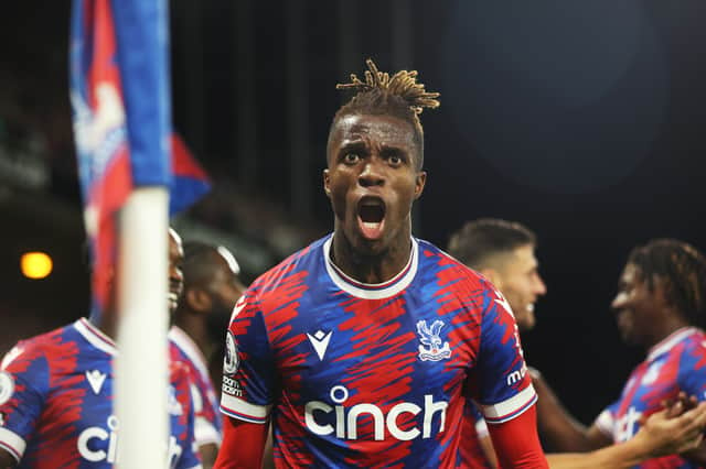 Wilfried Zaha of Crystal Palace celebrates after scoring their team’s first goal during the Premier League match (Photo by Eddie Keogh/Getty Images)