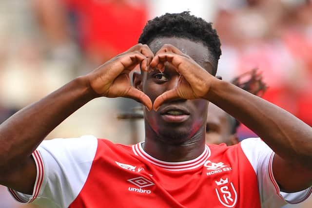 Reims’ English forward Folarin Balogun celebrates after scoring a penalty kick during the French L1 football match (Photo by FRANCOIS LO PRESTI/AFP via Getty Images)