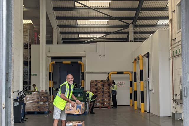 A volunteer at the Felix Project warehouse in Poplar