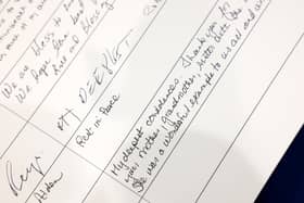 Messages are left in a condolence book for Queen Elizabeth II