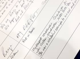 Messages are left in a condolence book for Queen Elizabeth II