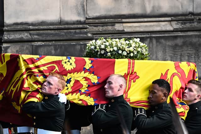 Pallbearers carry the coffin of Queen Elizabeth II into St Giles Cathedral. Photo: Getty