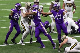 Taysom Hill #7 of the New Orleans Saints scores a touchdown during the fourth quarter  against the Minnesota Vikings