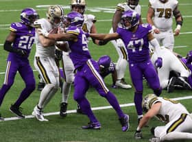 Taysom Hill #7 of the New Orleans Saints scores a touchdown during the fourth quarter  against the Minnesota Vikings