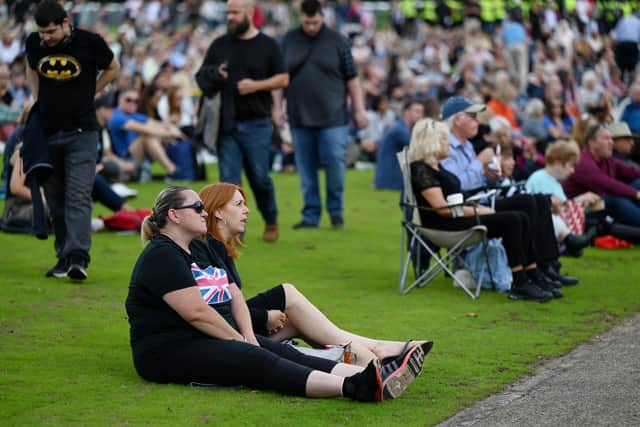 Mourners gather to watch the procession for the lying-in-state of Queen Elizabeth II at the Hyde Park screening site. Photo: Getty