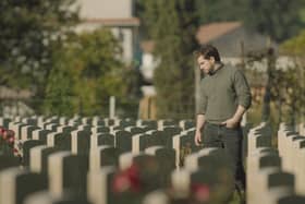 Kit Harrington visits a war cemetery