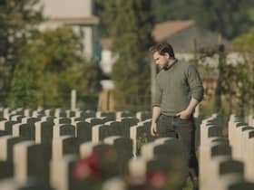 Kit Harrington visits a war cemetery