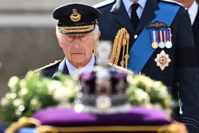 King Charles III walking behind his mother’s coffin as the cortege proceeds to Westminster Hall from the palace. Photo: Getty