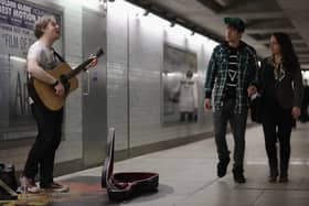A busker plays at an Underground station. Photo: Getty