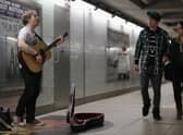 A busker plays at an Underground station. Photo: Getty