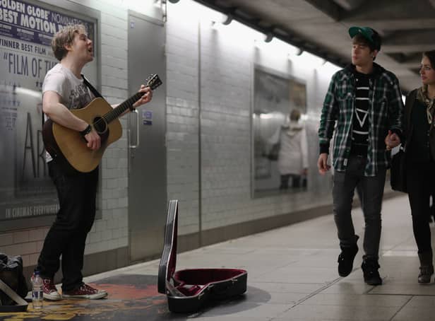 <p>A busker plays at an Underground station. Photo: Getty</p>