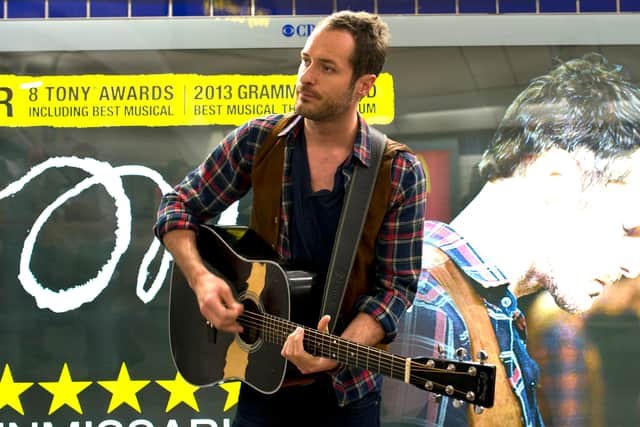 Declan Bennett from the musical ‘Once’ celebrates the 10th anniversary since busking was made legal on the tube in 2013. Photo: Getty