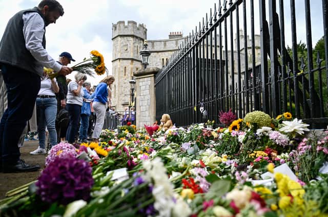 Flowers laid at the Queen’s home at Windsor Castle. Photo: Getty