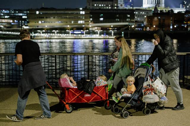 Families and children are in the queue with buggies and pushchairs. Photo: Getty