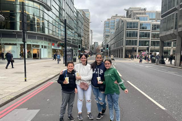 Ellen, left, and Sarah, right, with their children, before queuing to see the Queen’s coffin. Photo: Rahman Osman