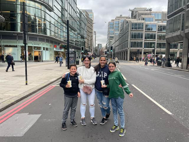 Ellen, left, and Sarah, right, with their children, before queuing to see the Queen’s coffin. Photo: Rahman Osman