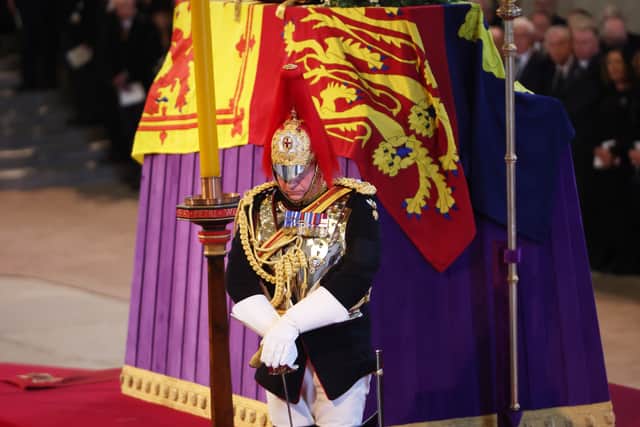 A soldier stands guard over the coffin carrying Queen Elizabeth II as it rests in Westminster Hall. Photo: Getty