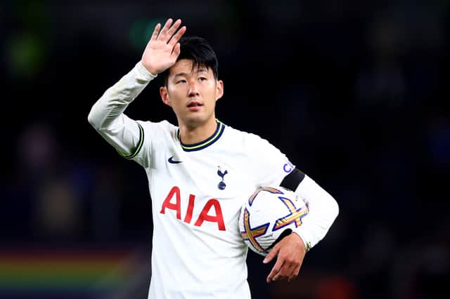 Son Heung-Min of Tottenham Hotspur celebrates victory with their hat-trick match ball (Photo by Clive Rose/Getty Images)