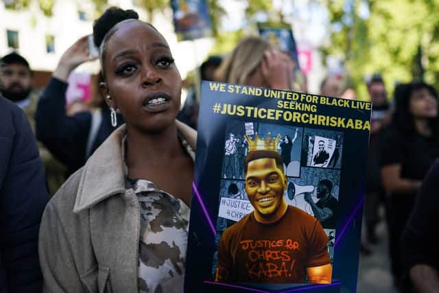 Protestors held placards calling for justice. Photo: Getty