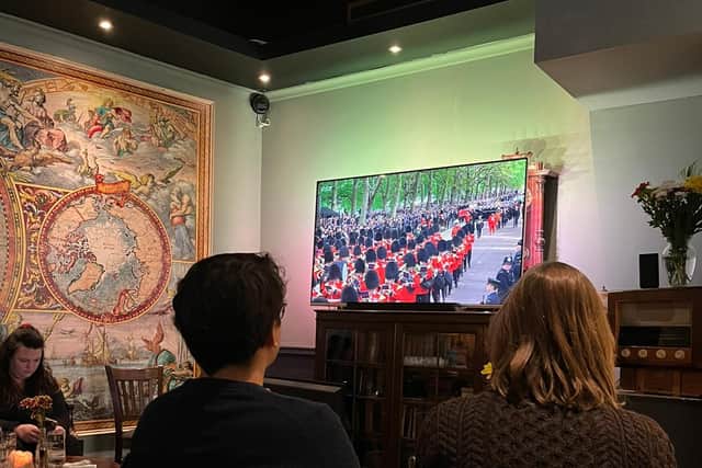 The Queen’s funeral is shown on a live stream in the pub. Photo: LondonWorld