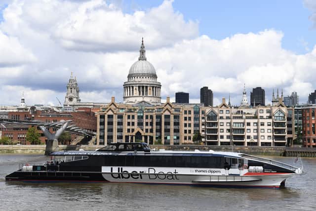 An Uber boat passes St Paul’s cathedral in partnership with Thames Clippers. Photo: Getty