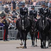 Mounted Metropolitan Police take part during the procession ahead of the state funeral. Photo: Getty